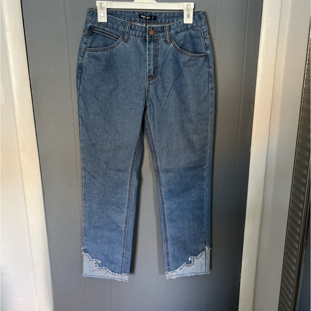 Blue distressed jeans with frayed hem